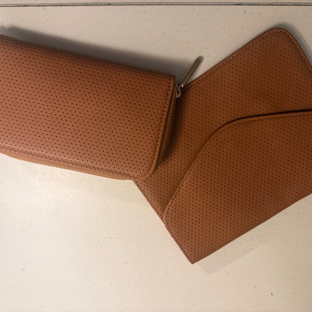 Thirty-One Slim wallet and fold over clutch in perforated camel